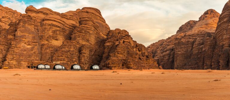 Beautiful panorama with bubble tents near the mountains of Wadi Rum, Unesco Heritage, Jordan at sunset