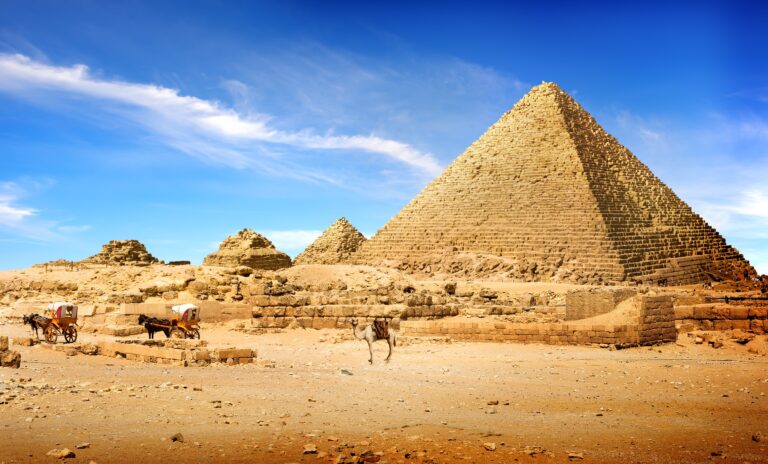 Egyptian pyramids in sand desert and clear sky